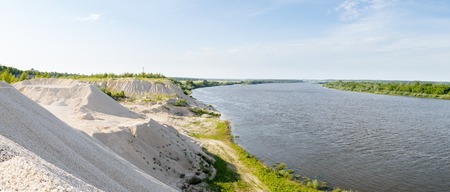 limestone mountains on the banks of a large riverの写真素材