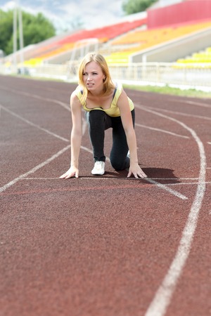 runner - woman running outdoors training . Beautiful fit  fitness model in her 20sの写真素材