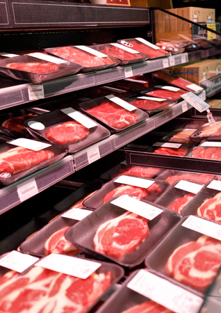 Showcase meat products in a supermarketの写真素材