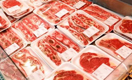 Showcase meat products in a supermarketの写真素材
