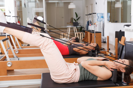 people in the gym with modern fitness equipment