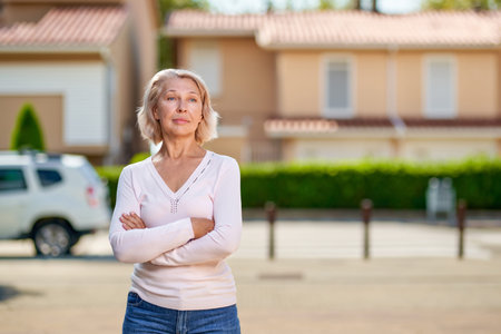 Portrait of a beautiful mature woman on a street background