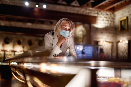 Woman exploring medieval expositions in museumの写真素材