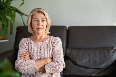 Close up Portrait Senior Woman Sitting on Sofaの写真素材