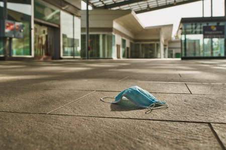 Antivirus mask in an empty abandoned market mallの写真素材