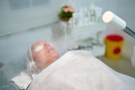 Doctor is making beauty procedure in cosmetology clinic.の写真素材