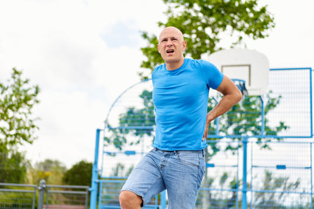 man at sports has problems pain with health on the basketball court