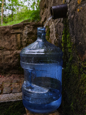 Bottle with fresh cold natural spring water from sourceの写真素材