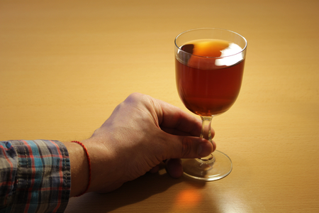 Hand holding a glass of wine.Alcohol.の写真素材
