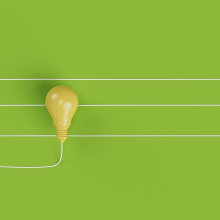 Yellow Lightbulb line on pastel green background for copy space. top view. minimal concept.の写真素材