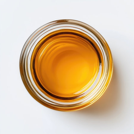 Glass of whiskey isolated on white background. Top view. Flat lay.の素材