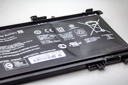 Heidelberg, Germany - August 02, 2019: Replacement of a defect, bloated HP Notebook Lithium-ion batteryのeditorial素材