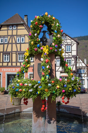 Neckargemuend, Germany - April 9, 2017: Easter decoration at a fountain on the historical market place of Neckargemuend, a town near Heidelberg, Germanのeditorial素材