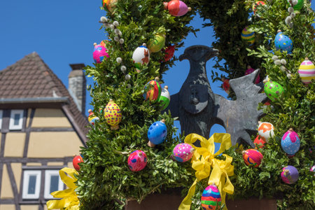 Neckargemuend, Germany - April 9, 2017: Easter decoration at a fountain on the historical market place of Neckargemund, a town near Heidelberg, Germanのeditorial素材