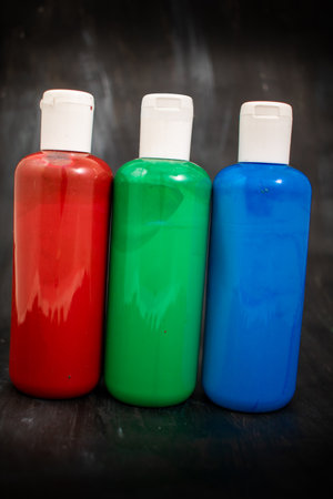 Three bottles of acrylic paint in the order red, green, blue, the primary colors of the additive RGB color spaceの写真素材