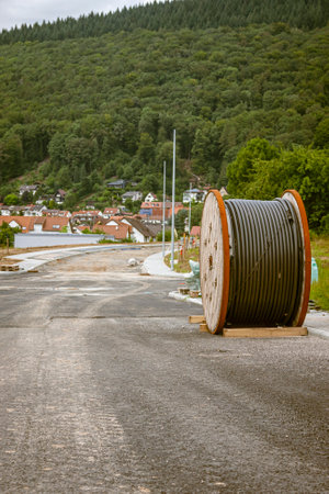 Cable drum for power cable during road construction in a new development area in Germanyの写真素材