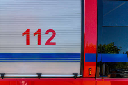 Fire Truck Roller Shutter door on a german fire engine with the european Emergency telephone number 112 printed onの写真素材