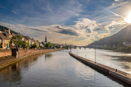 beautiful view of Heidelberg an Neckar River in summer evening light. Heidelberg in Germany is known for its university and romantic flairの写真素材