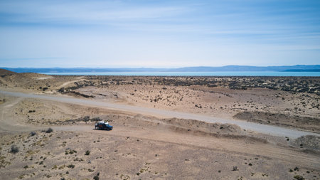 aerial of offroad vehicle standing in the desert landscape of Patagonia, Argentina. 4x4, 4WD truck standing in a desertの写真素材