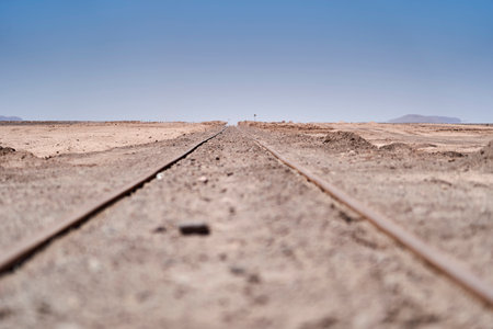railway tracks to now there leading straight to the horizon in the atacama desert of Chile in South Americaの写真素材