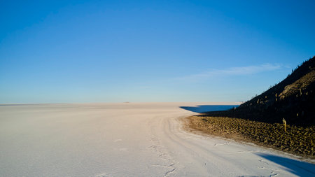 Aerial of Salar de Uyuni, Salar de Tunupa, worlds largest salt flat, in the altiplano of Bolivia in the andes mountains. Worlds biggest lithium source and popular travel destination in South Americaの写真素材