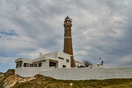 Cabo Polonio, Uruguay - 08 25 2019: lighthouse at a small settlement located in the eastern coast in the Rocha Department, with no roads connecting it to the outside world, South Americaのeditorial素材