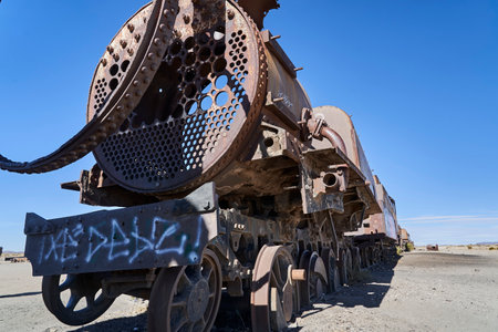 old rusty trains at the antique train cemetery close to the salt flats of Uyuni in Bolivia, rusting away in the sun. Lost places at the salar de Uyuni, Alti plano.のeditorial素材