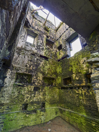 Old castle tower on the cliffs of Moher in Ireland, a popular hiking destination on a high rock formation on the atlantic coast.のeditorial素材