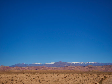 snow covered mountain peaks of the Atlas in the dry and arid desert region of Morocco in northern Africa.の写真素材