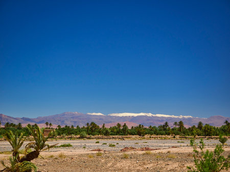 snow covered mountain peaks of the Atlas in the dry and arid desert region of Morocco in northern Africa.の写真素材