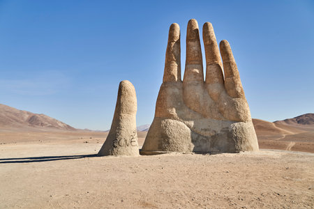 Antofagasta, Chile - 02 16 2019: Mano del desierto, a giant sculpture of a hand with fingertips reaching to the sky. located at the panamericana close to antofagasta in the atacama desert, chile.のeditorial素材