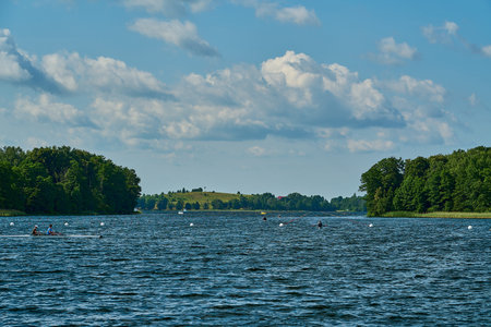rowing lanes near Trakai Island castle, a brick building, one of the most popular tourist...