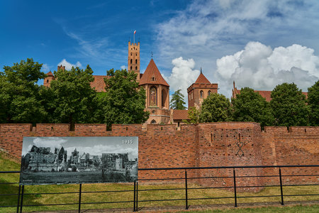 Malbork, Poland - 06 27 2023: The Castle of the Teutonic Order in Malbork along the Nogat river in Poland is the biggest brick building in the world.の写真素材
