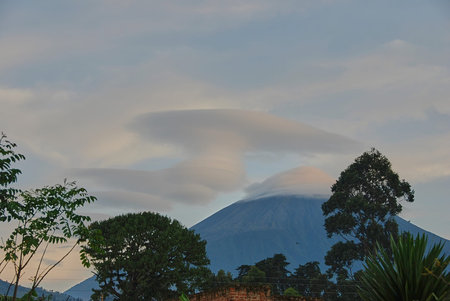 tips of the famous Virunga Volcanos in east Africa, covered in clouds. A popular travel destination...