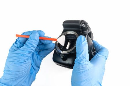cleaning of a camera body with a swab and gloves