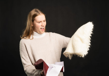A young woman is angry about her present