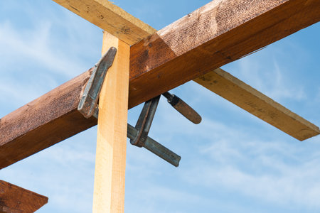 a wooden structure is held together with a clamp