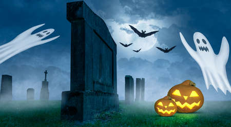 a spooky halloween background with ghosts on a cemeteryの写真素材