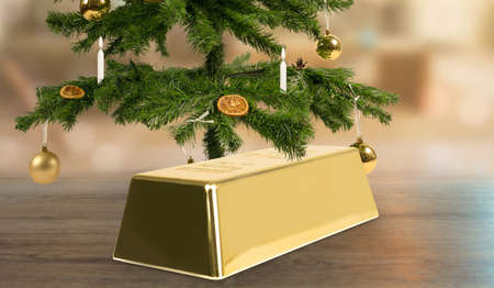 a gold bar as a christmas present under a christmas tree as an investmentの写真素材