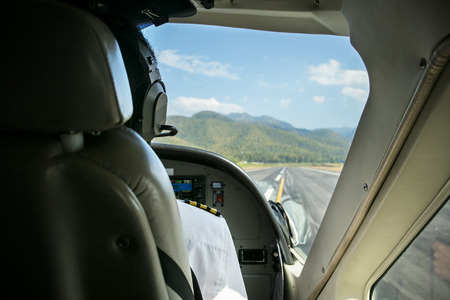 A pilot on duty in cockpitの写真素材