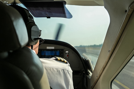 A Pilot on duty in cockpitの写真素材