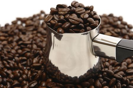                     Beans of coffee, falling out of coffee-pot on the white back ground.                  の写真素材