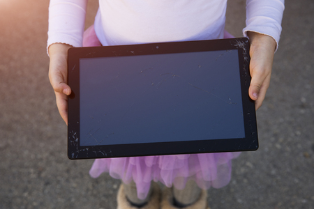 female near a broken car on the country road is calling on mobile phone.の写真素材
