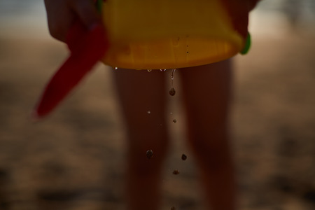 beach, boy, bucket, child, childhood fun game girl play sand seaの写真素材