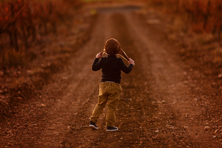 happy child playing pilot aviator and dreams outdoors in autumnの写真素材