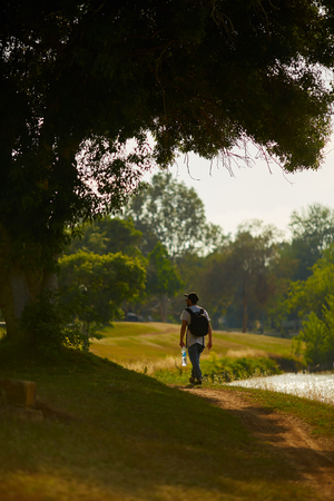 Man traveler with backpack hiking Travel Lifestyleの写真素材