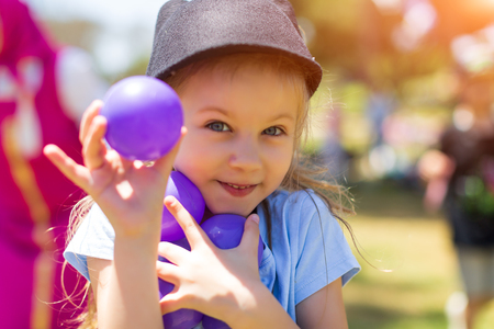 Happy little kid playing at colorful plastic balls playground high viewの写真素材