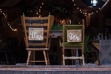 Designation of chairs for the bride and groom, Plate on a chairの写真素材