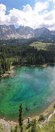 A Tranquil Mountain Lake that is Beautifully Surrounded by Lush, Vibrant Forests and Natureの写真素材