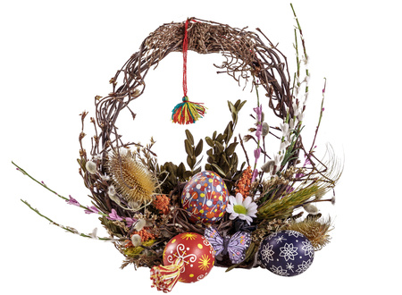 Easter wreath with Easter eggs and flowers isolate on the white background , useful as easter decoration. Happy Easterの写真素材